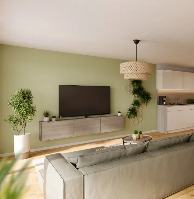 Modernes Wohnzimmer mit hellgrüner Wand, TV-Board in Holzoptik und vielen Zimmerpflanzen.